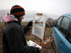 Painting through the snowstorm at Loch Tummel, March 2006; photograph is copyright  2006 by James G. Mundie. All rights reserved.  Reproduction prohibited.